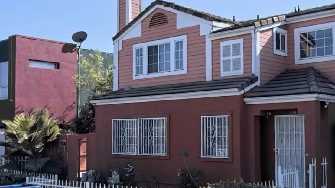 Home exterior before transformation in Watts
